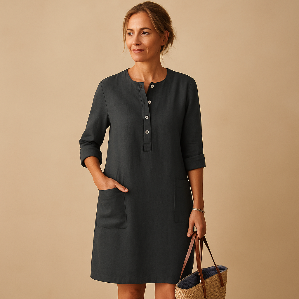 Casual women’s long shirt dress with rolled sleeves, side pockets, and button-down front, perfect for everyday comfort and relaxed style.