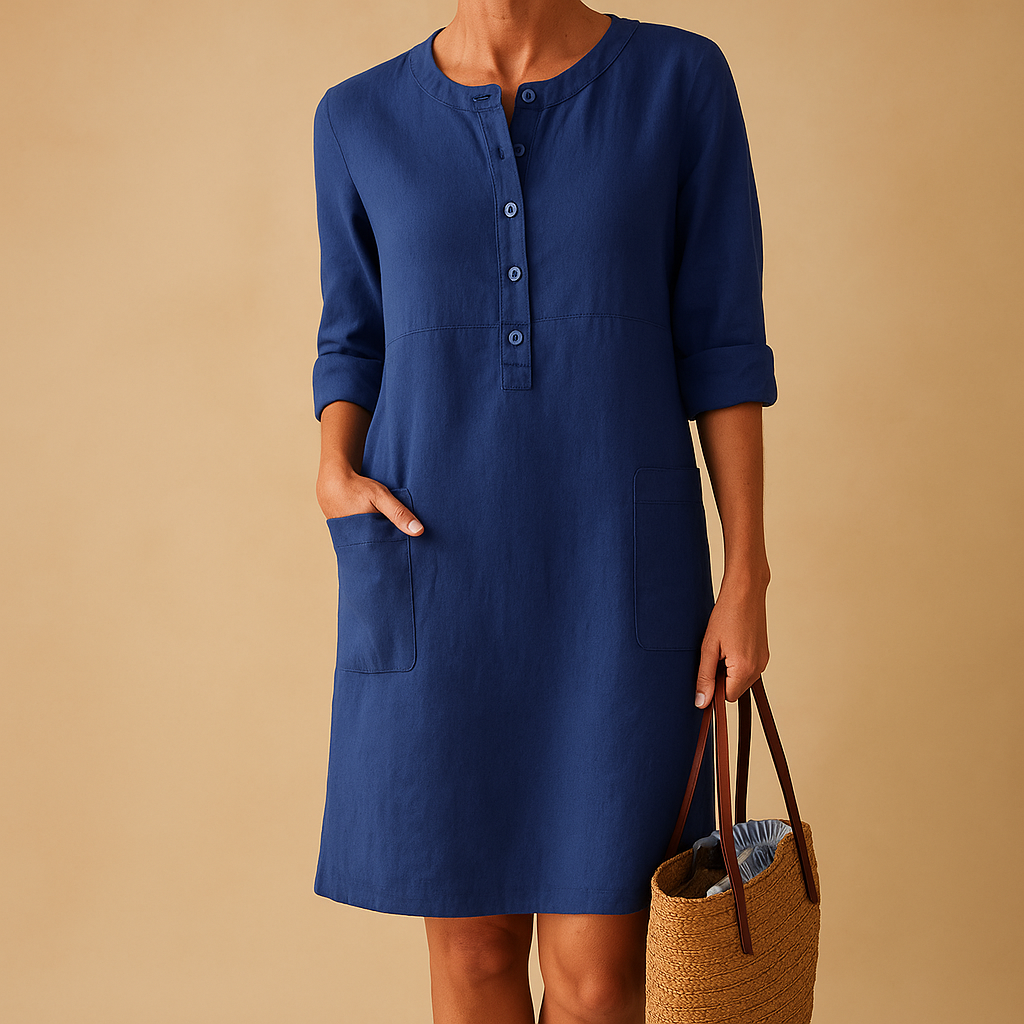 Casual women’s long shirt dress with rolled sleeves, side pockets, and button-down front, perfect for everyday comfort and relaxed style.