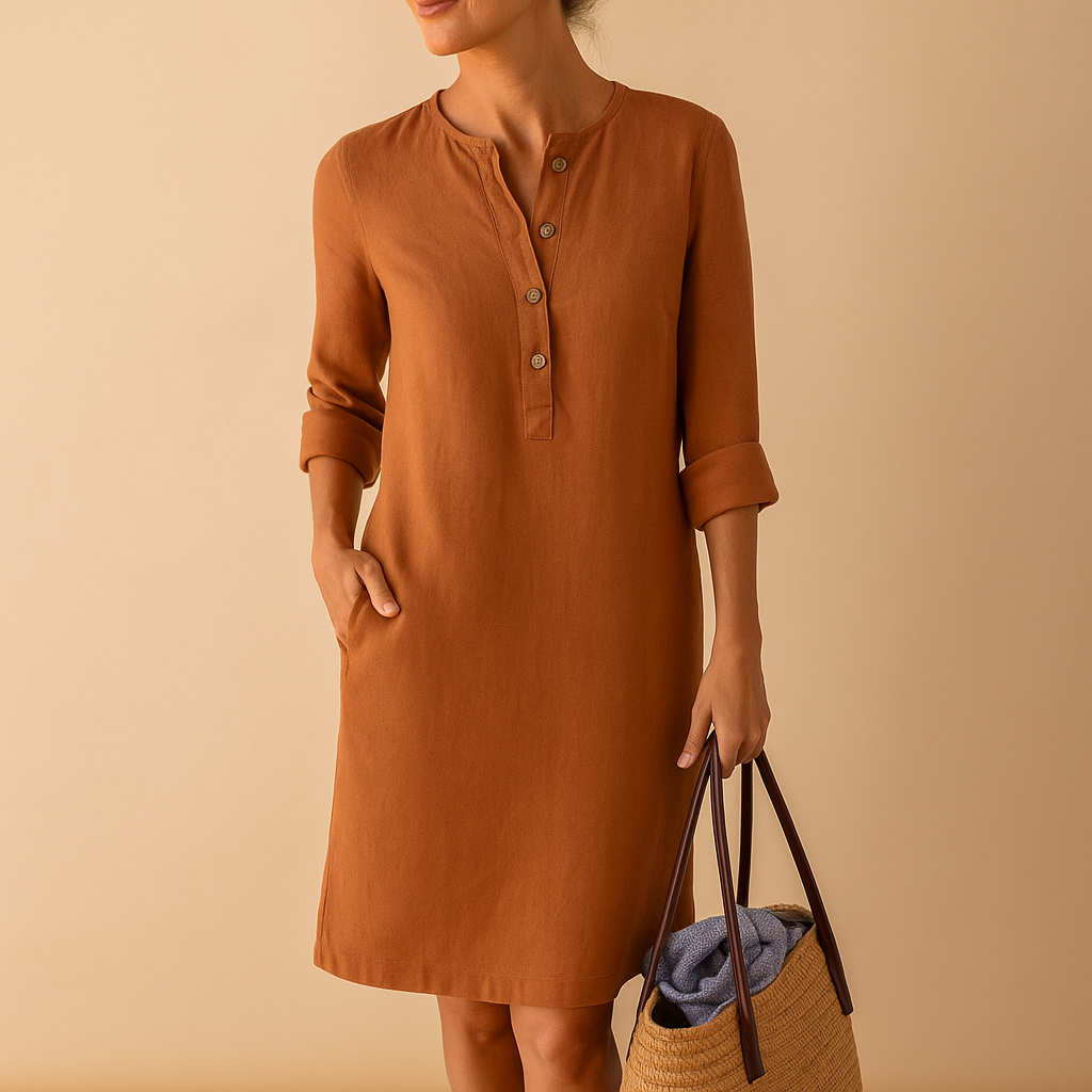 Casual women’s long shirt dress with rolled sleeves, side pockets, and button-down front, perfect for everyday comfort and relaxed style.