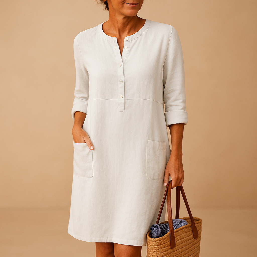 Casual women’s long shirt dress with rolled sleeves, side pockets, and button-down front, perfect for everyday comfort and relaxed style.