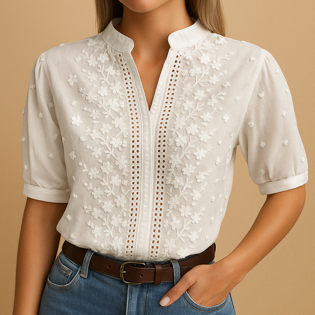 White elegant women’s blouse with classic collar and button closure, perfect for work, leisure, or evening occasions.