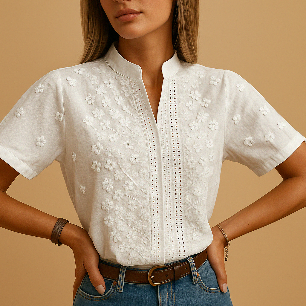 White elegant women’s blouse with classic collar and button closure, perfect for work, leisure, or evening occasions.