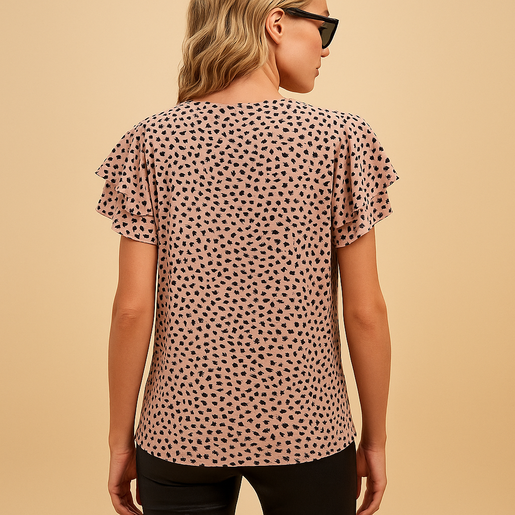 Women’s flowy top with bold print and flattering fit — elegant, colorful, and perfect for casual or dressy occasions.