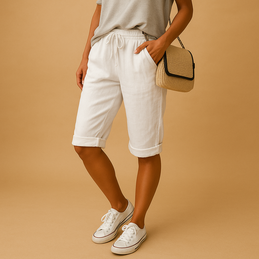 Capri pants with elastic waist and drawstring for women, featuring a relaxed fit and rolled hem. Perfect for casual summer days and evening outings.