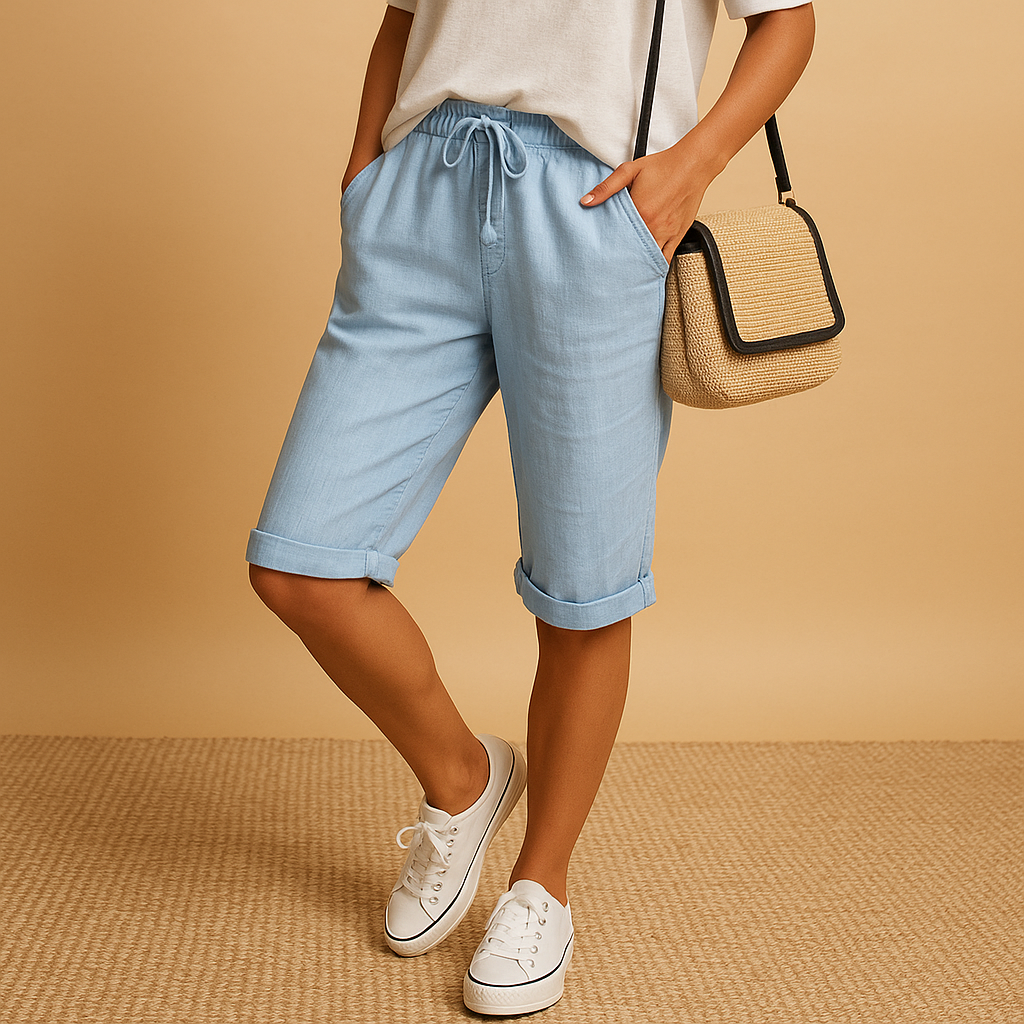 Capri pants with elastic waist and drawstring for women, featuring a relaxed fit and rolled hem. Perfect for casual summer days and evening outings.