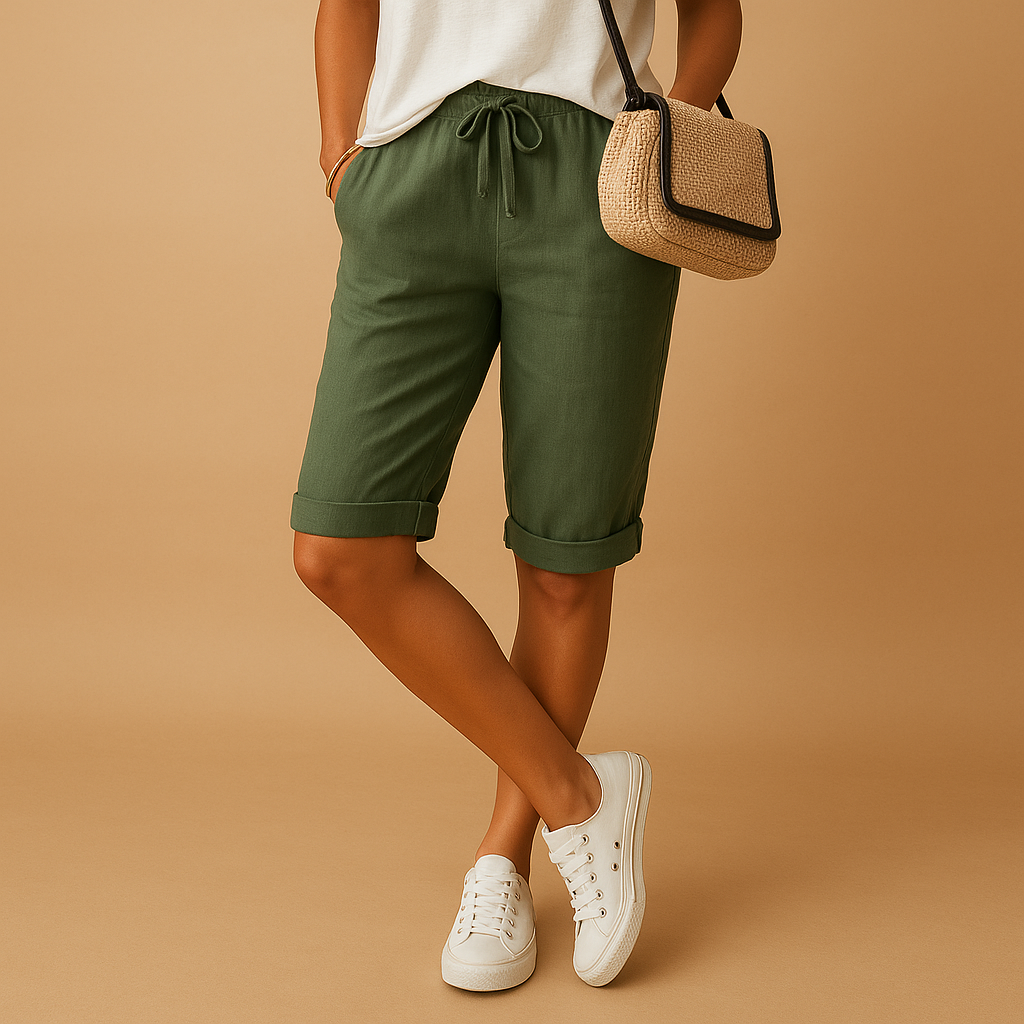 Capri pants with elastic waist and drawstring for women, featuring a relaxed fit and rolled hem. Perfect for casual summer days and evening outings.