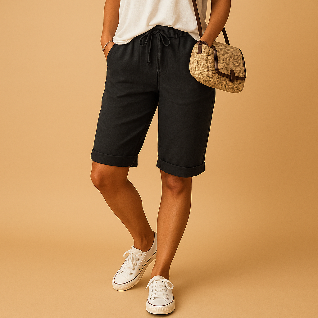 Capri pants with elastic waist and drawstring for women, featuring a relaxed fit and rolled hem. Perfect for casual summer days and evening outings.