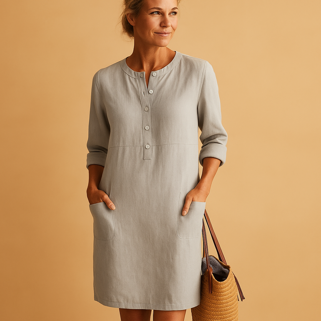 Casual women’s long shirt dress with rolled sleeves, side pockets, and button-down front, perfect for everyday comfort and relaxed style.