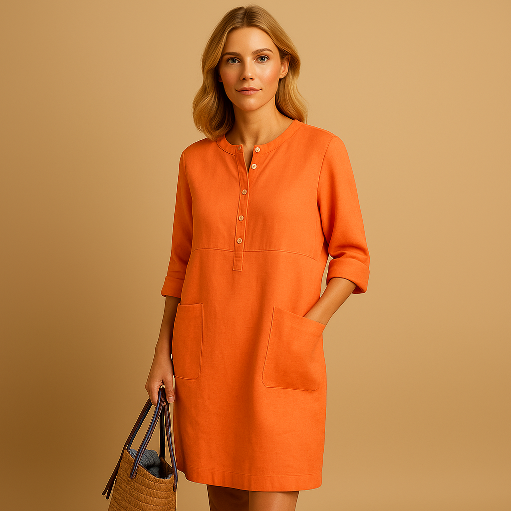 Casual women’s long shirt dress with rolled sleeves, side pockets, and button-down front, perfect for everyday comfort and relaxed style.