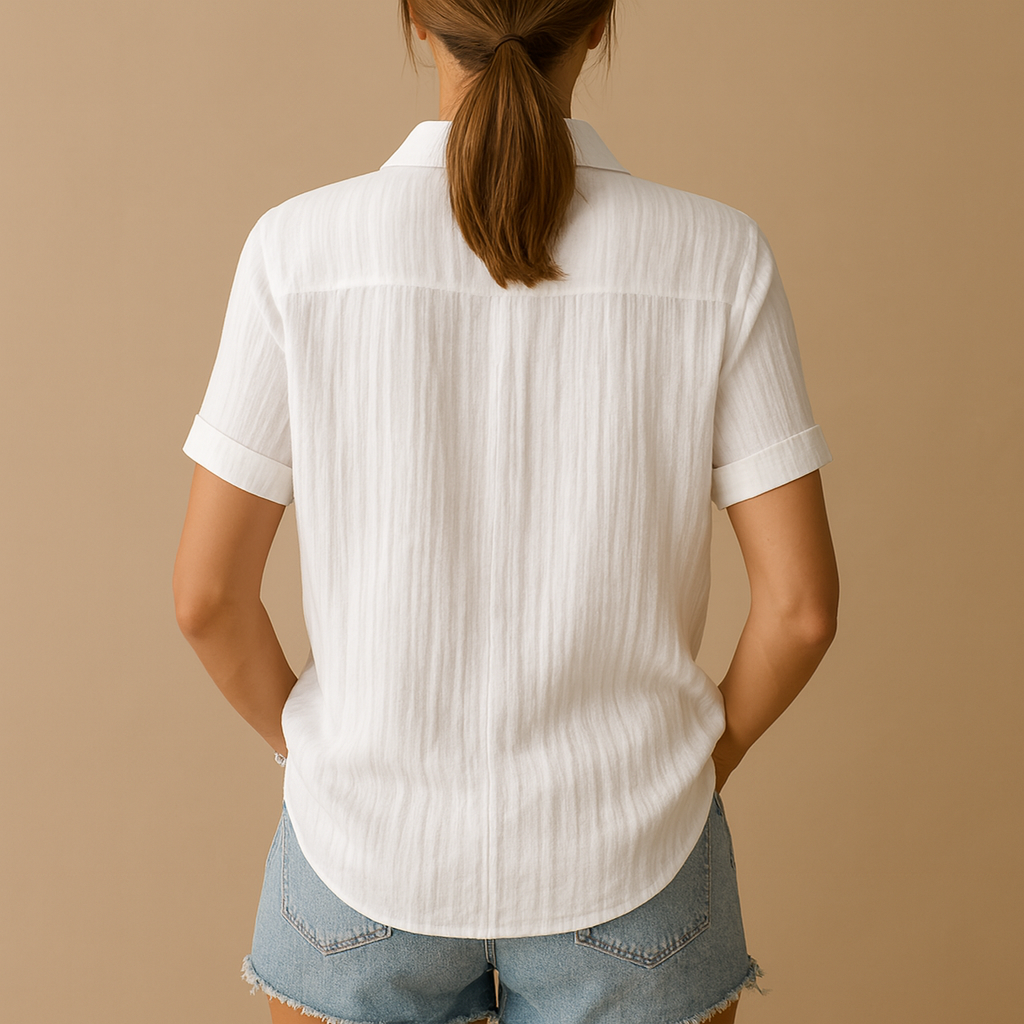 Elegant short-sleeve blouse for women in white with relaxed fit and chest pocket, ideal for work or casual wear.