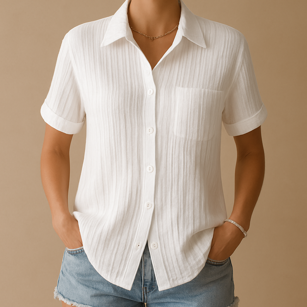 Elegant short-sleeve blouse for women in white with relaxed fit and chest pocket, ideal for work or casual wear.