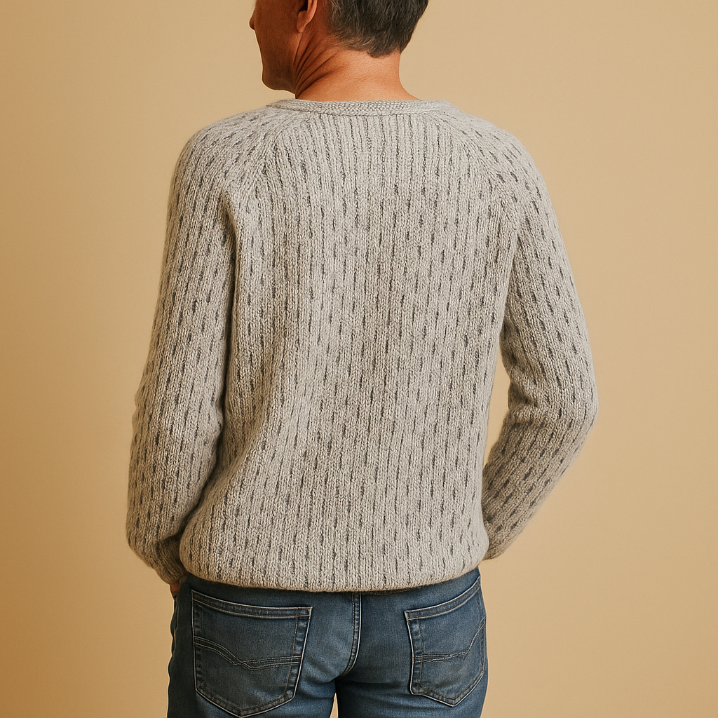 Women’s elegant knitted winter sweater in gray, perfect for layering over blouses or under coats for casual or formal looks.