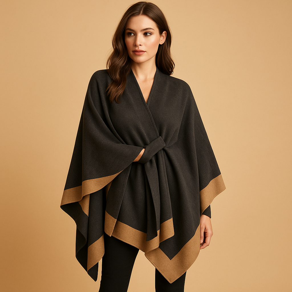Elegant women’s poncho with flowing fit and open sides, made from soft cashmere-style fabric, ideal for layering in autumn and winter.