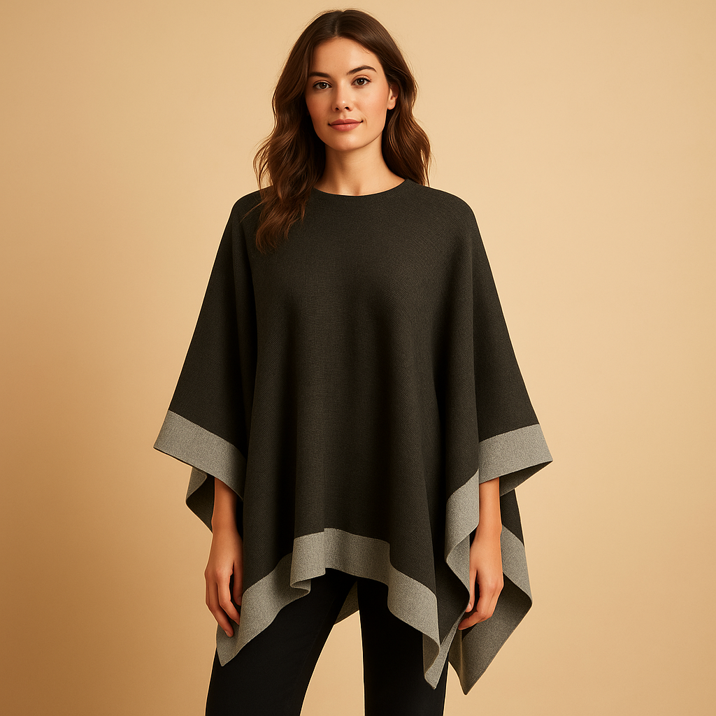 Elegant women’s poncho with flowing fit and open sides, made from soft cashmere-style fabric, ideal for layering in autumn and winter.