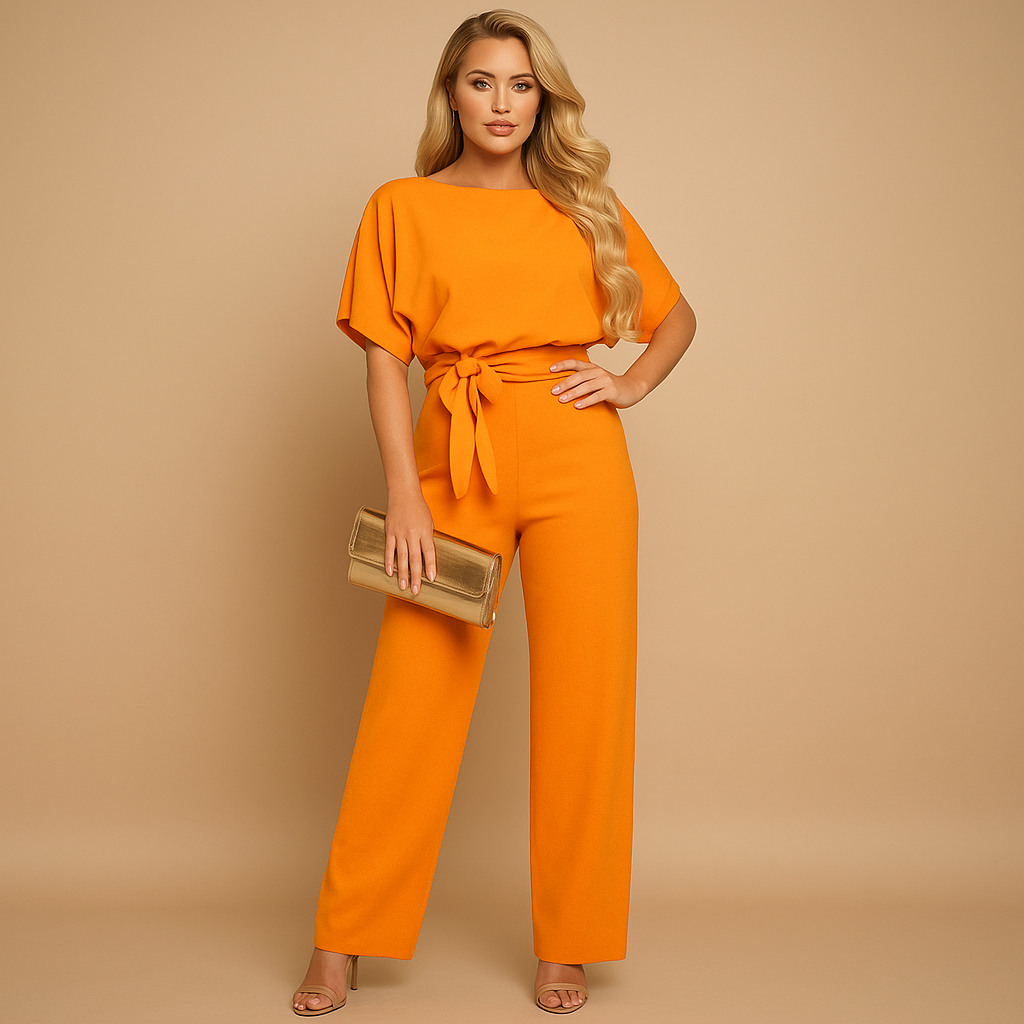 Women’s glitter halter jumpsuit with open back and flared legs, perfect for parties, galas, and festive evening occasions.
