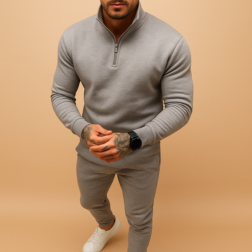 Modern men’s jogging set with half-zip sweatshirt and matching joggers. Comfortable fit, perfect for casual days, light sports, or relaxing at home.