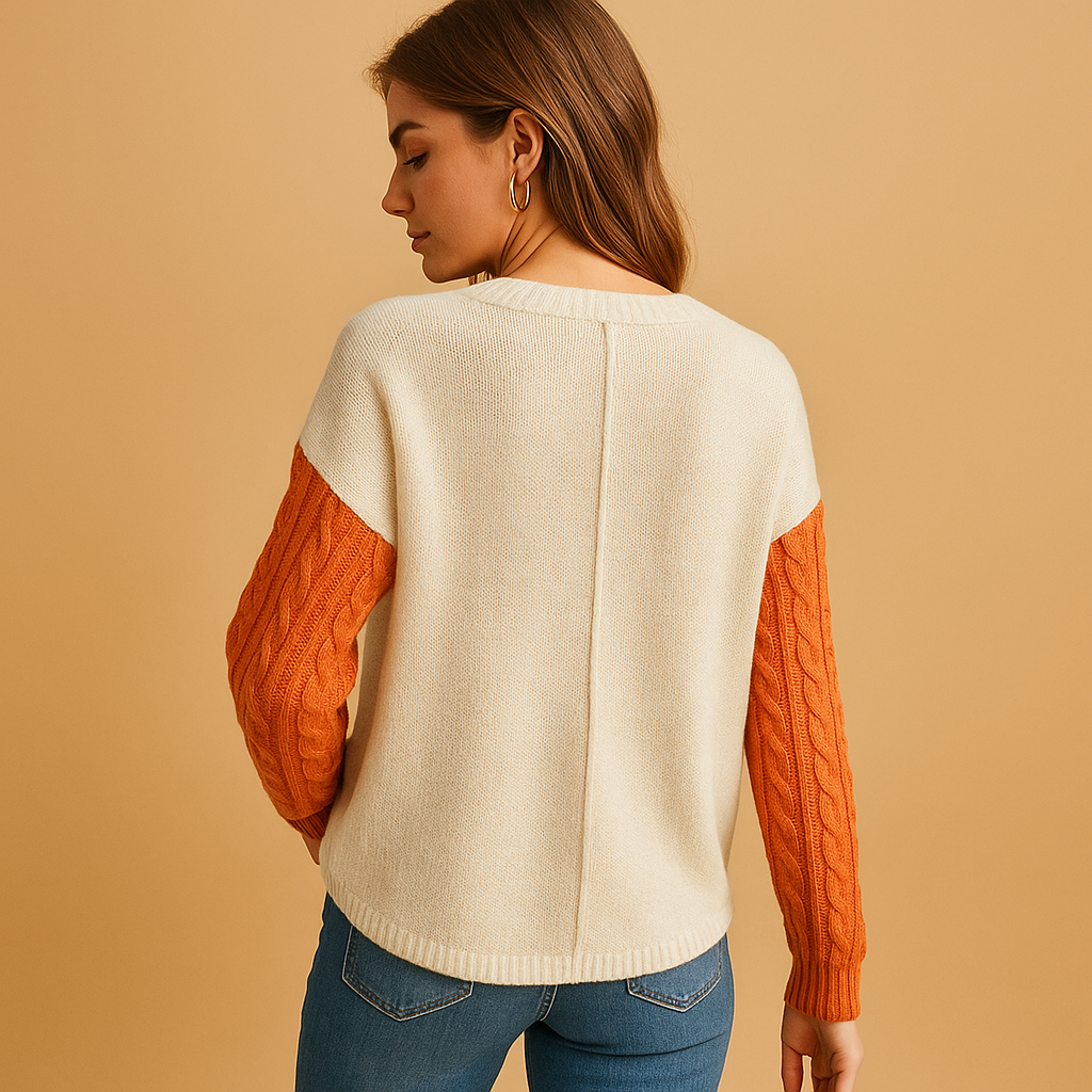 Women’s knit sweater with cable pattern, dropped shoulders, and pocket detail. Relaxed fit, perfect for casual wear, layering, or cozy days at home.