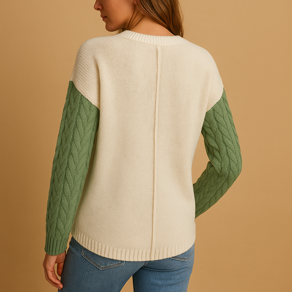 Women’s knit sweater with cable pattern, dropped shoulders, and pocket detail. Relaxed fit, perfect for casual wear, layering, or cozy days at home.