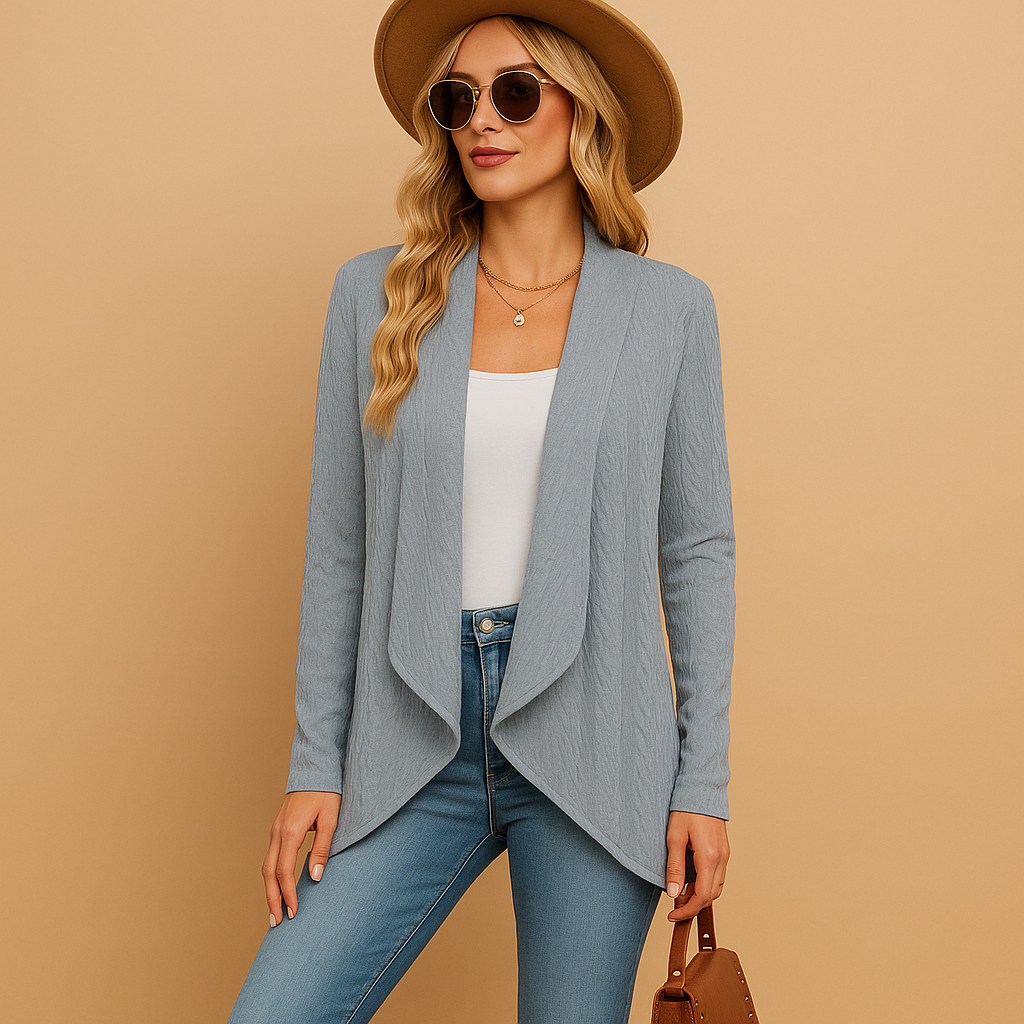 Women’s long knitted cardigan with relaxed fit and soft knit texture, designed in solid colours, ideal for layering in spring and autumn.