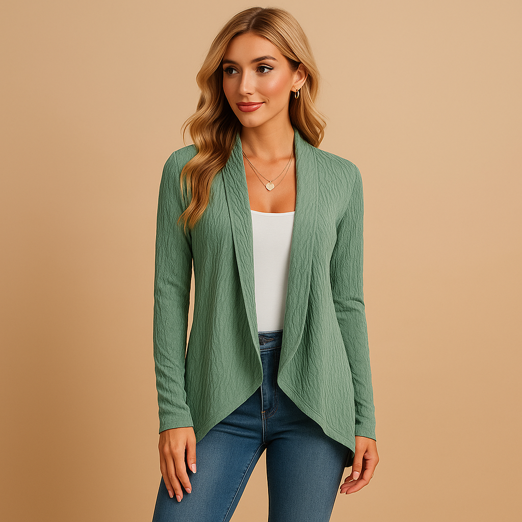 Women’s long knitted cardigan with relaxed fit and soft knit texture, designed in solid colours, ideal for layering in spring and autumn.