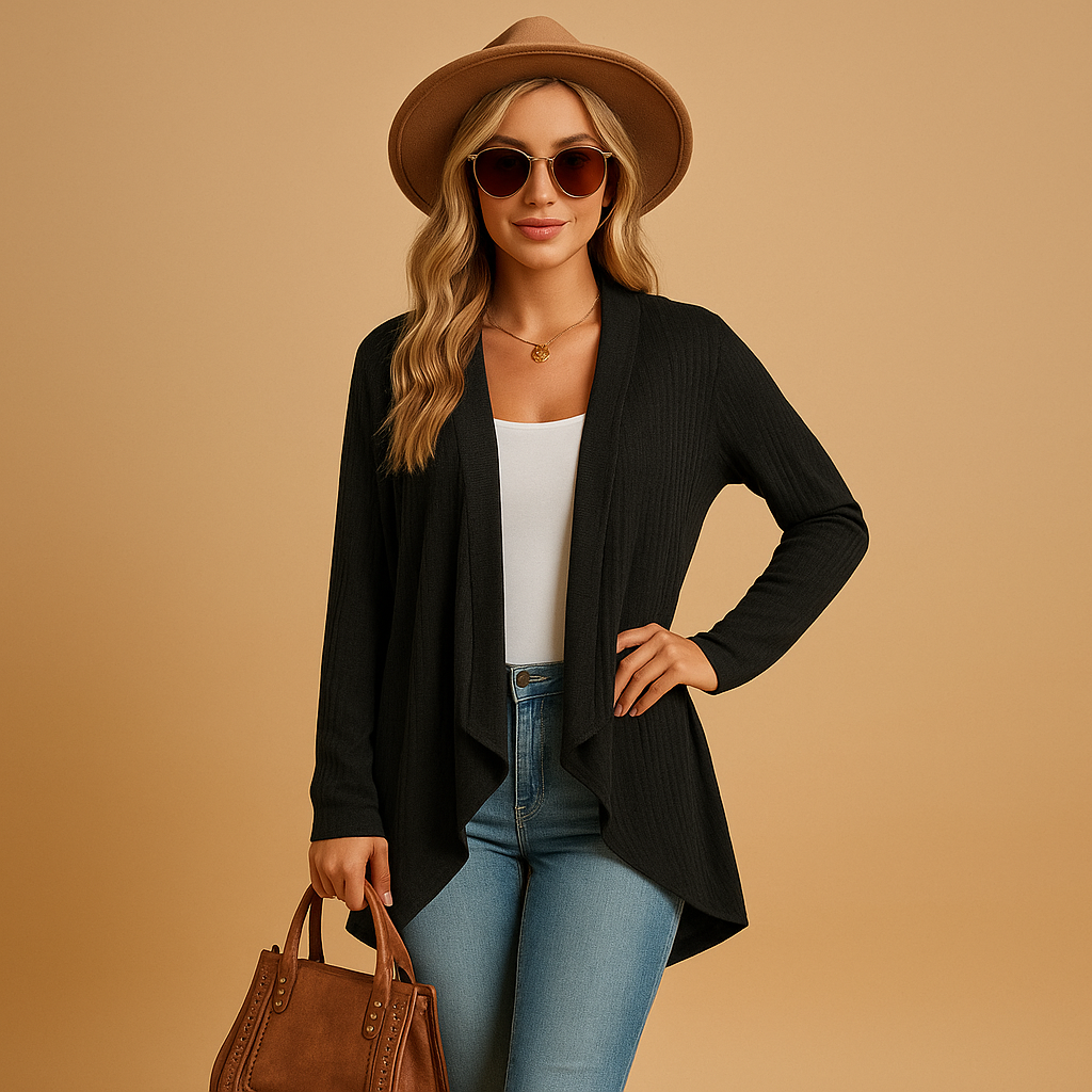 Women’s long knitted cardigan with relaxed fit and soft knit texture, designed in solid colours, ideal for layering in spring and autumn.