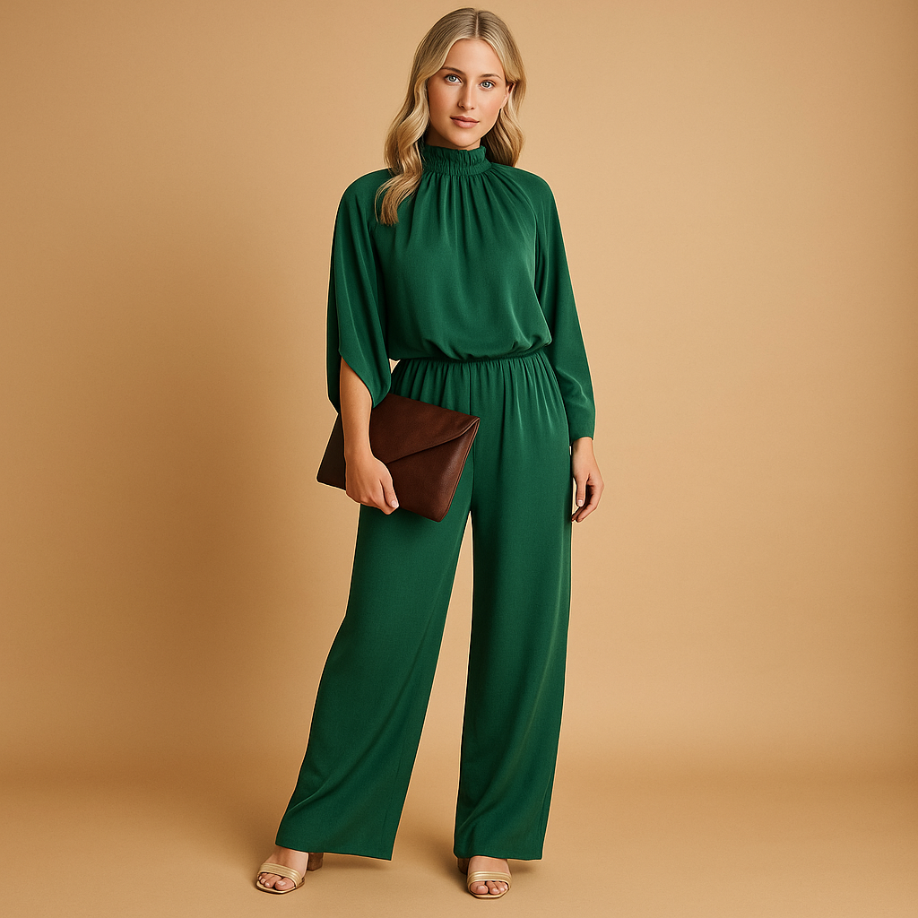 Women’s long sleeve wide leg jumpsuit in green with a relaxed fit and cinched waist. Perfect for elegant daywear, dinners, and formal occasions.