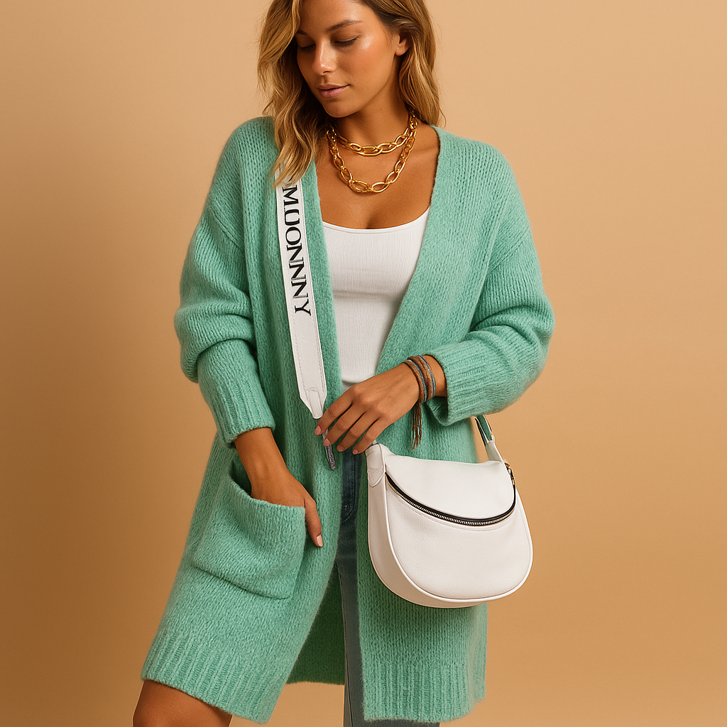 Women’s oversized open front cardigan with flowing fabric, chic tailored details, and neutral tones, ideal for layering in casual or stylish outfits.